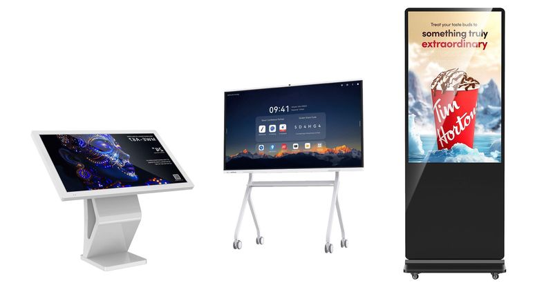 Digitale Displaylösungen Die Abbildung zeigt moderne digitale Displaylösungen für Unternehmen, Bildungseinrichtungen und öffentliche Bereiche. Präsentiert werden eine Digital Signage Stele für aufmerksamkeitsstarke Werbung und Informationsdarstellung, ein Digital Kiosk für interaktive Selbstbedienung und Kundeninformation sowie ein interaktives Whiteboard für digitale Meetings, Präsentationen und Zusammenarbeit. Die hochwertigen Touch-Displays überzeugen durch brillante Bildqualität, intuitive Bedienung und vielseitige Einsatzmöglichkeiten.